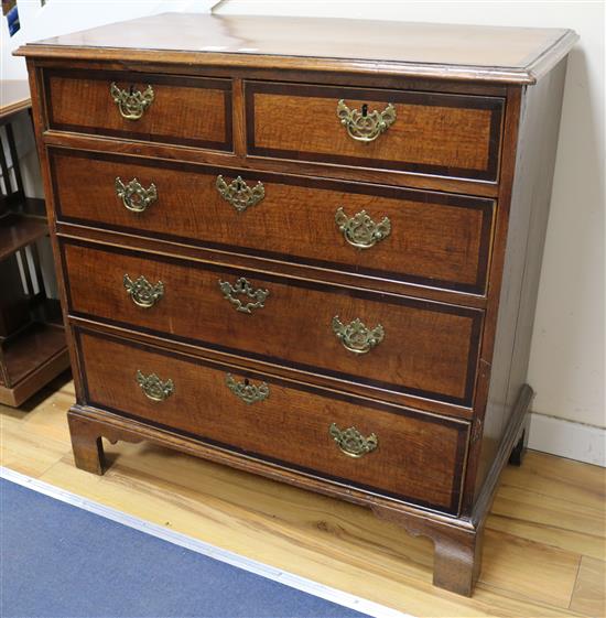A late 18th century oak and mahogany crossbanded chest of drawers, W.96cm